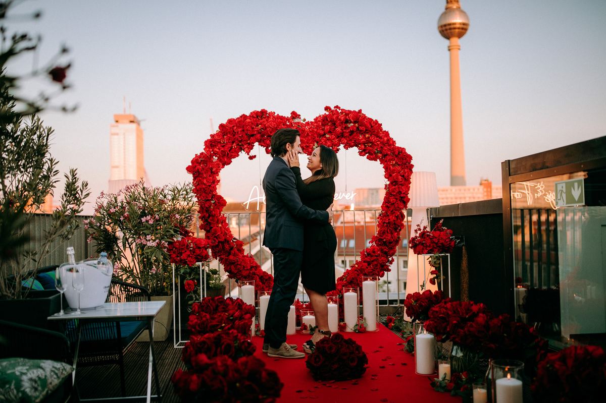 Marriage proposal in Berlin – TV Tower rooftop, red heart with couple at sunset