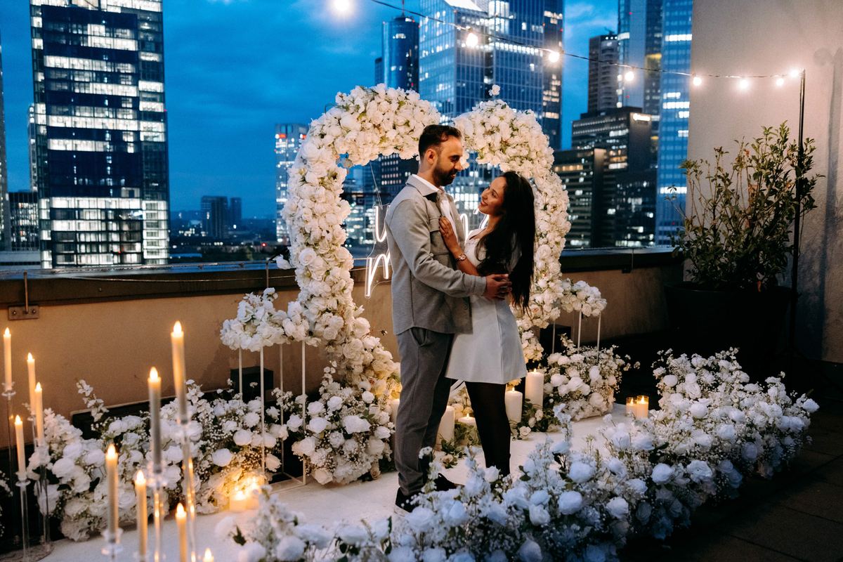 Marriage proposal in Frankfurt – stunning skyline view at night with white heart and candles